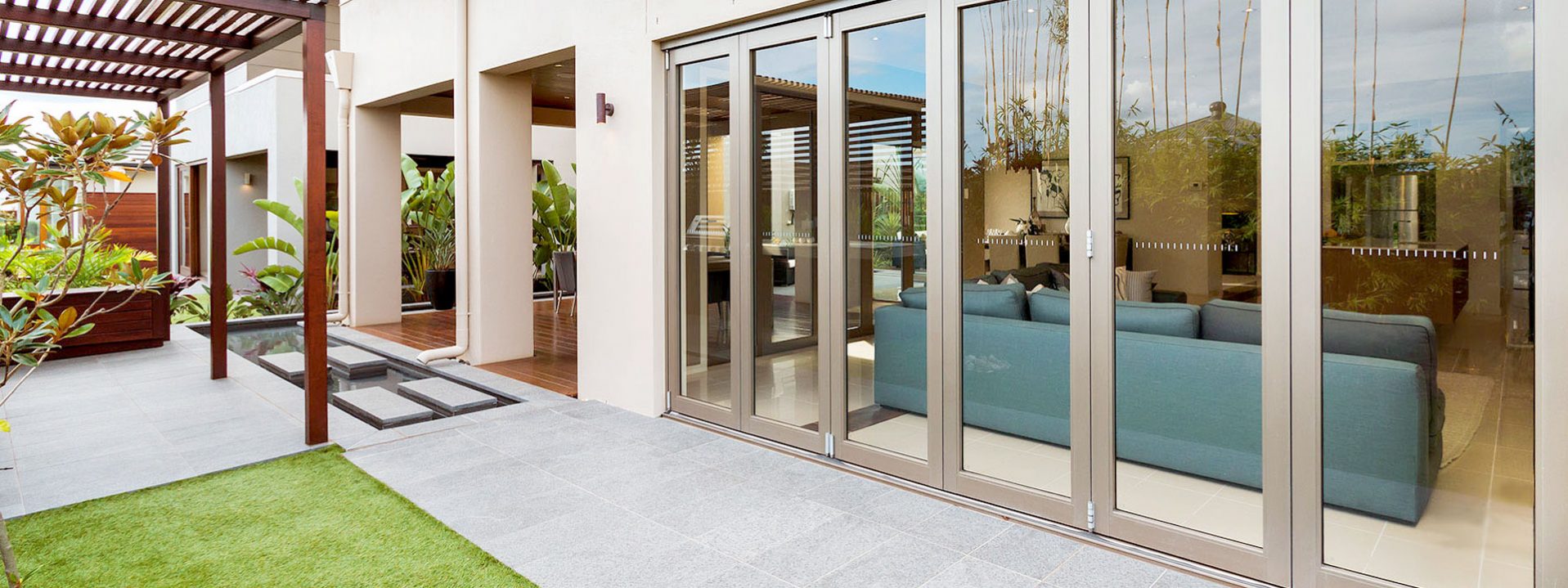 Aluminium bifold security doors located in an Balcatta backyard.